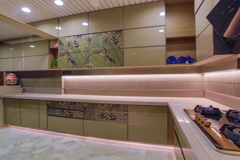 Stylish modern kitchen featuring green cabinets and minimalist design.