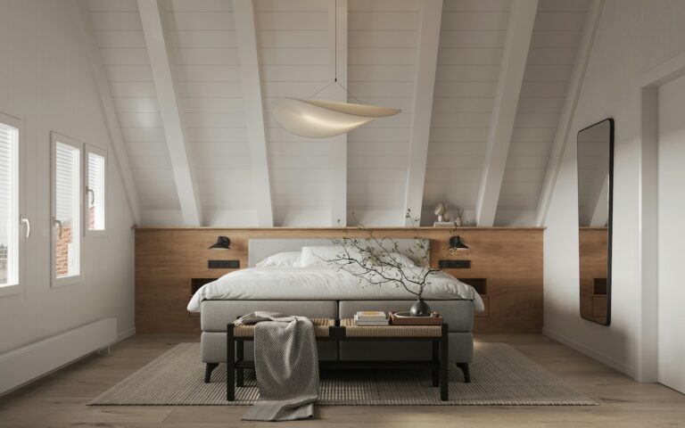 A bedroom with a bed and a table in it